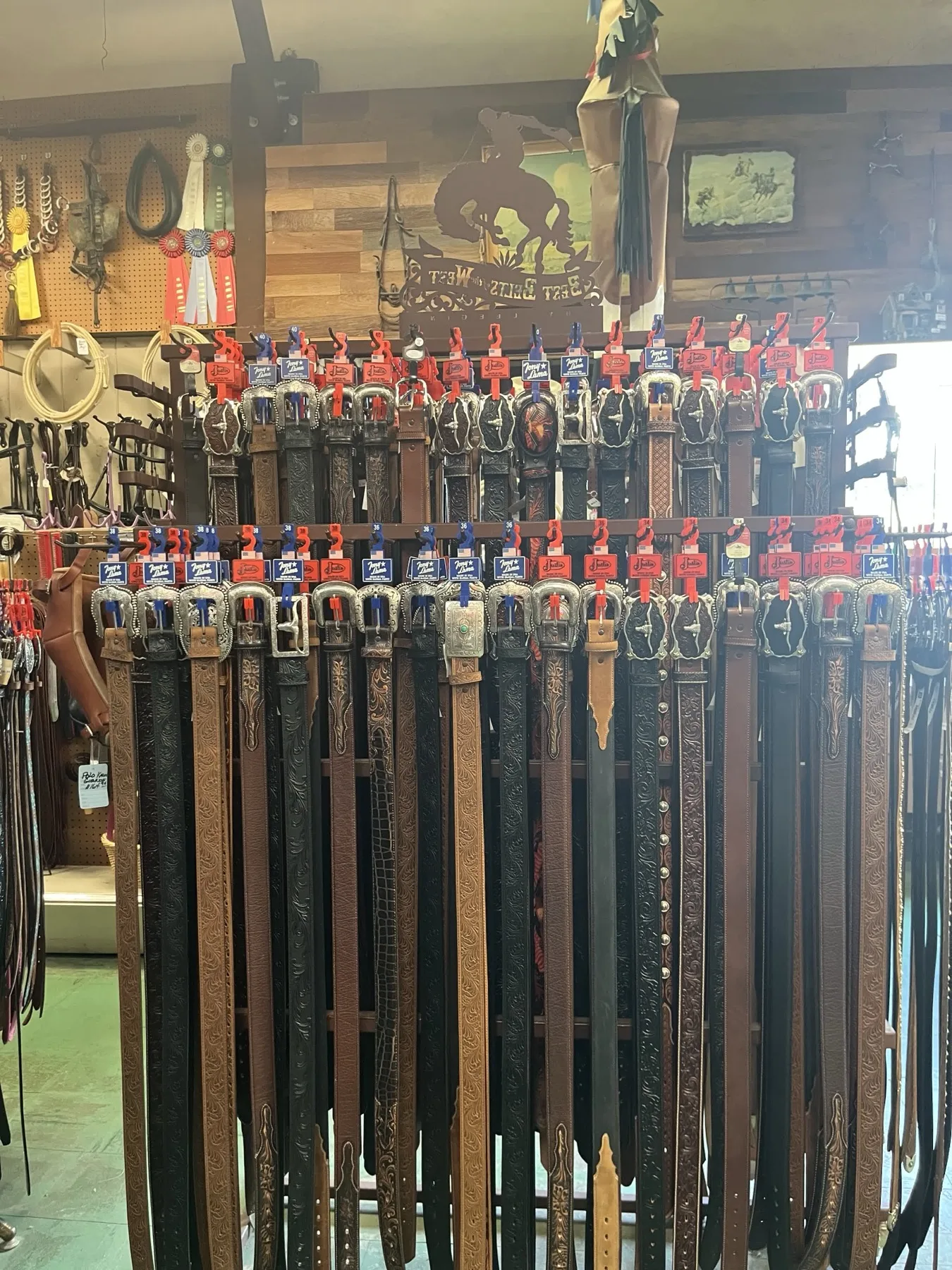Leather belts and buckles displayed in the western shop
