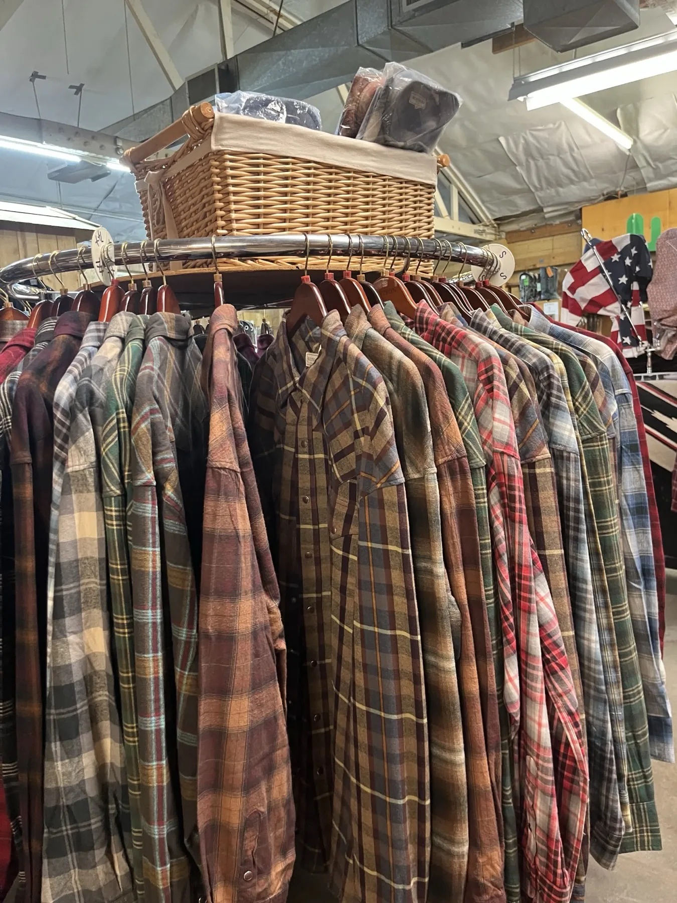 Assorted flannel shirts arranged on a circular rack
